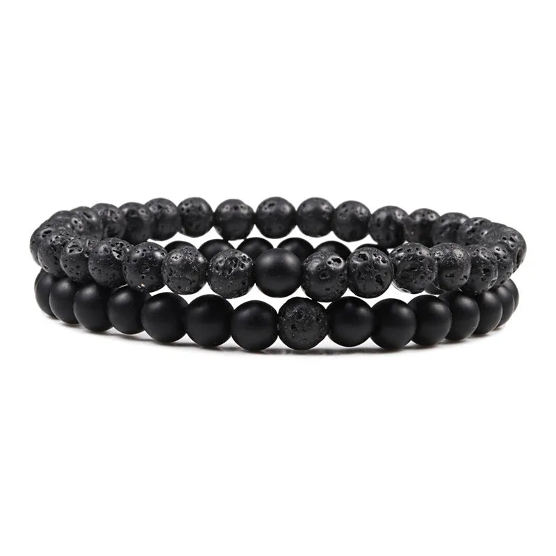 Duo de bracelets Équilibre en pierre naturelle noire, avec perle en pierre de lave brute et perle polie, symbole de force et d’élégance.