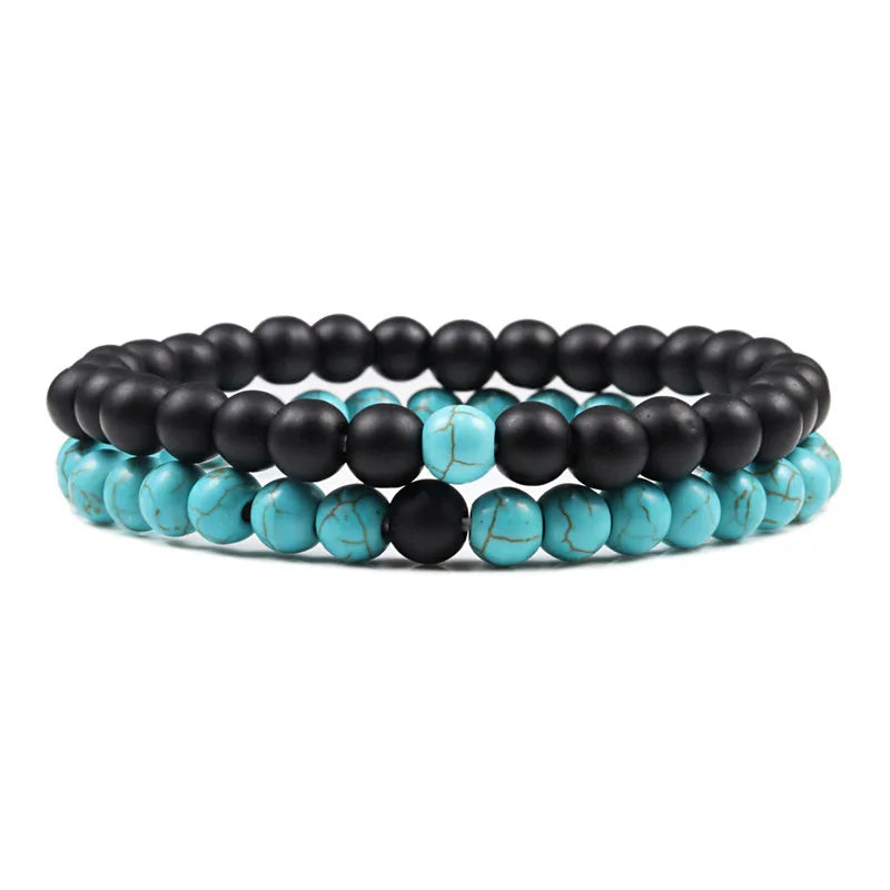 Duo de bracelets Mystique en pierre naturelle noire et bleu/vert veiné, symbole de sérénité et de force intérieure.