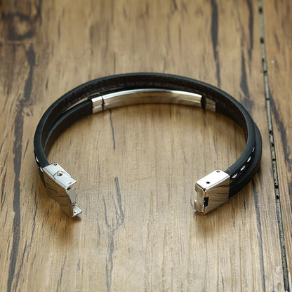Bracelet homme Chronos en cuir noir et acier inoxydable, vu ouvert pour mettre en valeur son design structuré.