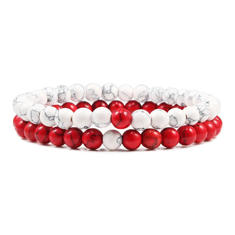 Duo de bracelets Audace en pierre naturelle rouge et blanche, symbole de passion et de pureté.