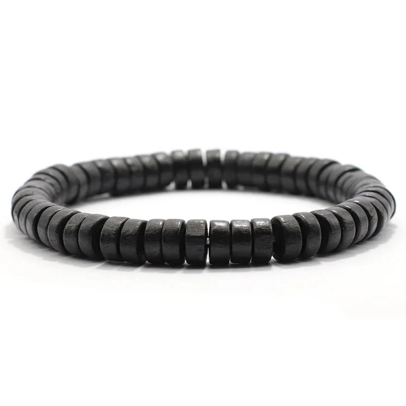 Bracelet homme Éthos en perles de bois noir, accessoire sobre et intemporel pour un look minimaliste.